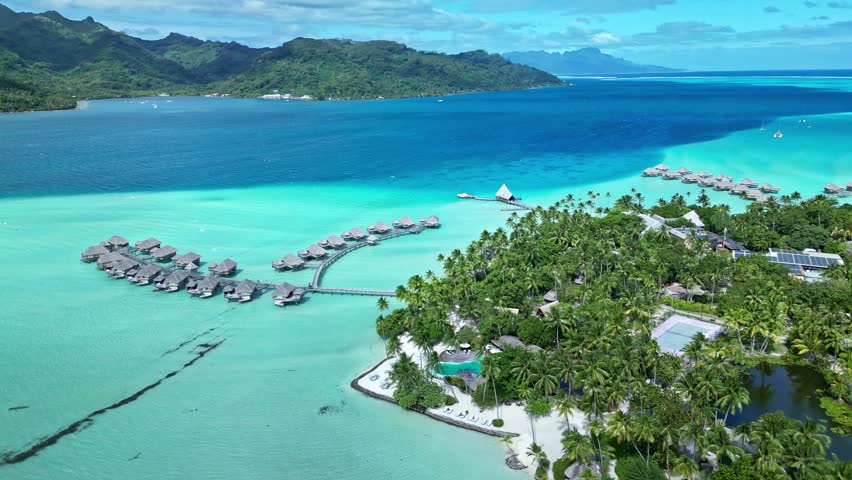 Tahaa island , french polinesia aerial view of a luxurious resort with overwater bungalows in a crystal clear turquoise lagoon