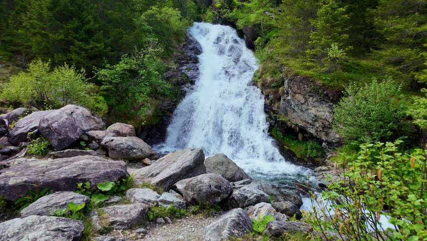Scenery waterfall route. Nature mountain landscape. Waterfall landscape. Nature wildness. Rapid waterfall travel destination. Picturesque waterfall. Travel destination.