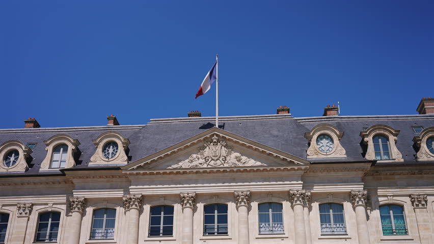 Historic Building With French Flag In Paris