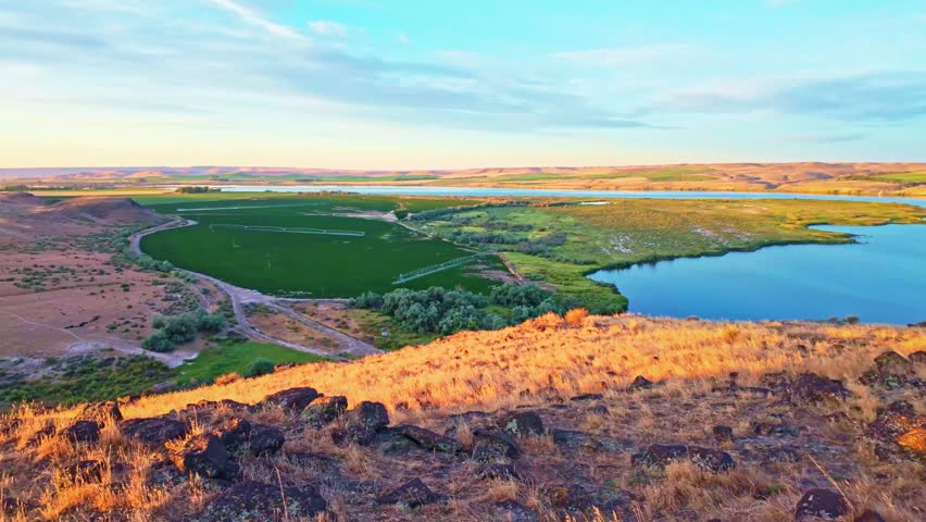 Calm morning view of Lucky Peak Lake surrounded by scenic desert buttes near Boise Idaho