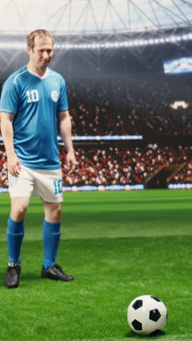 Vertical screen: Soccer player with ball control in attack action running forward, striker accelerating with possession and agility past defenders, with football footwork on stadium pitch.