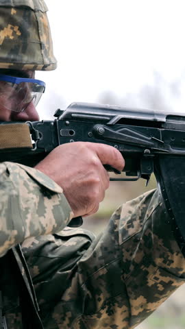 War Ukraine Russia. The Ukrainian military fires from a machine gun.