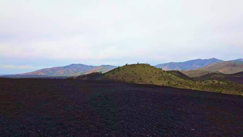Weird and scenic landscape of Craters of the Moon National Monument and Preserve showing lava fields and cinder cones in Idaho