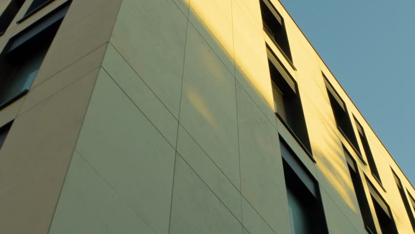Close-up low angle view of modern building facade with rectangular windows in Gdynia, Poland