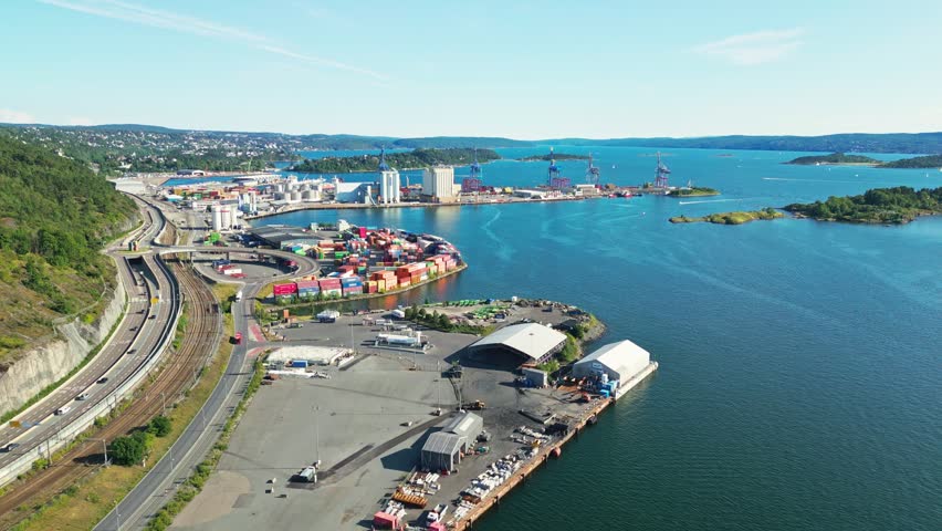 Aerial view of Oslo Port featuring industrial shipping containers, cranes, and coastal infrastructure along the fjord in Oslo, Oslo, Norway.