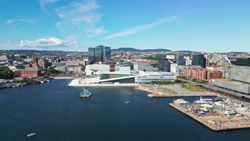 Aerial view of the modern Oslo Opera House on the waterfront with surrounding fjord and city skyline in Oslo, Oslo, Norway.