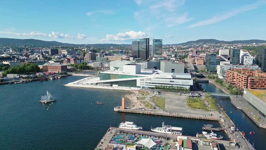 Aerial view of the modern Oslo Opera House with its white marble roof and glass facade overlooking the harbor in Oslo, Oslo, Norway.