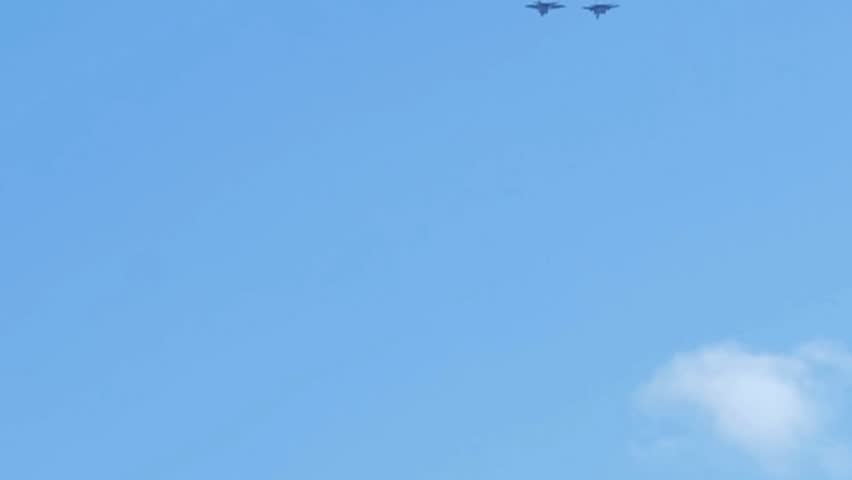 F-22 Raptor Formation Flight Against Clear Blue Sky