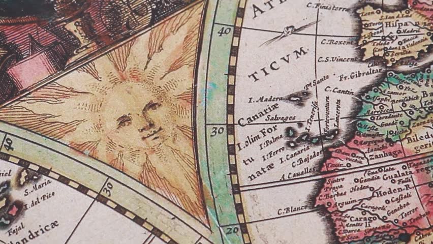 Detailed view of an illustration of the sun at the left of the screen into a modern printed reproduction of a 17th century world map