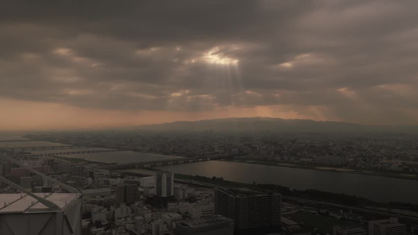 Panoramic View Of Osaka From The Umeda Sky Building. City Buildings Alongside The Yodo River In Japan. Wide Shot