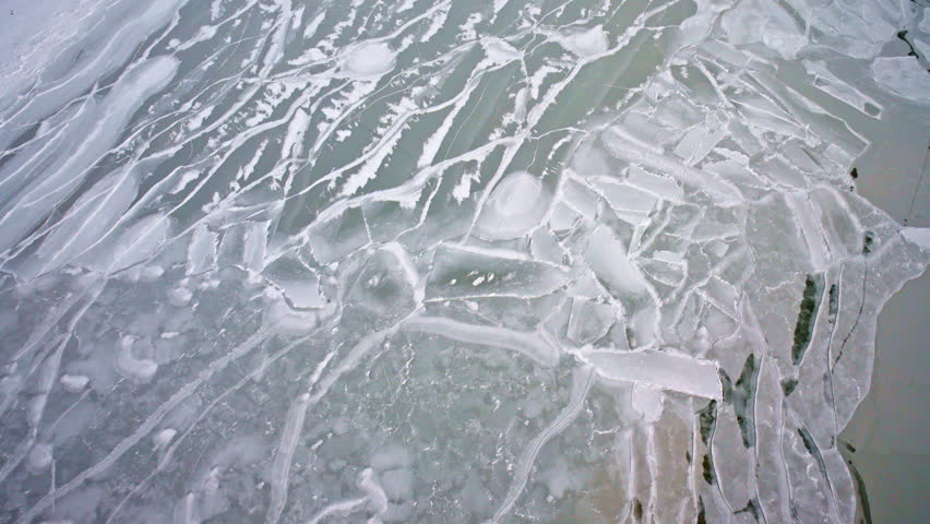 Drone view of remarkable frozen ice formations spread across the surface of Lake Michigan.