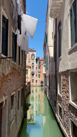 Traditional Gondola on a Quiet Canal in Venice, Italy – Vertical Travel Video