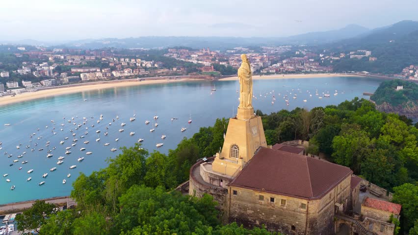 San Sebastián, a Spanish city, capital of Basque Country in Northern Spain, aerial view of San Sebastián harbor with a statue of Jesus Christ on a hill, tourism in San Sebastián, Spain