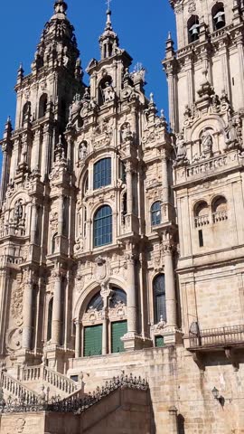 tilt up on Ornate baroque architecture of the cathedral of santiago de compostela. The main western facade with its bell towers and detailed sculptures