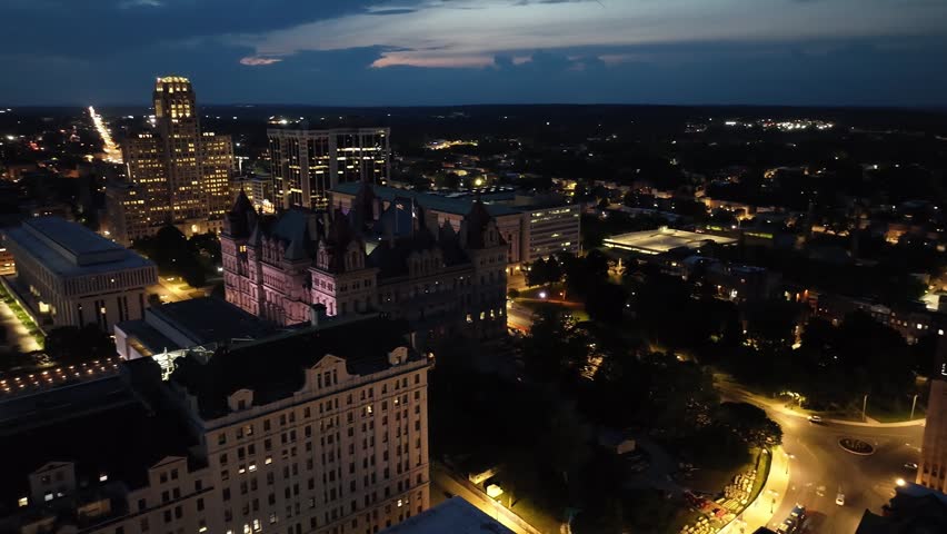 Albany, New York skyline at night with drone video panning.