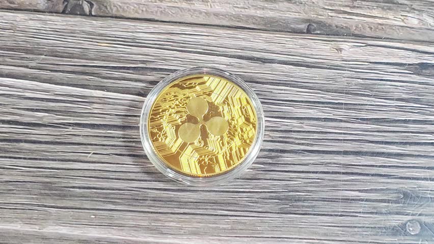 Obverse of Physical Ripple XRP, the native cryptocurrency of the XRP Ledger (XRPL), an open-source, decentralized blockchain technology, designed to facilitate fast cross-border payments