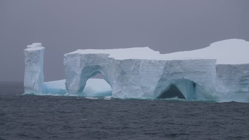 Massive Iceberg Floating in Cold Arctic Ocean Water, Panorama
