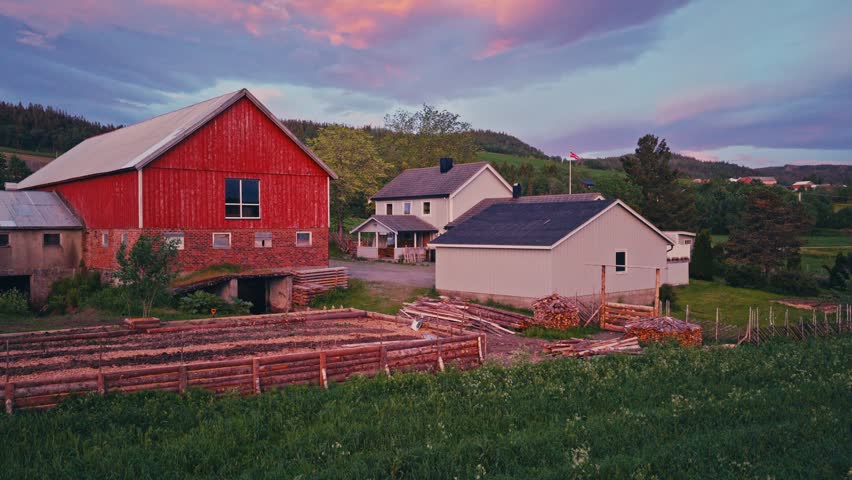 A Large DIY Raised Garden Bed Near A Barn And House In A Rural Countryside Landscape. Aerial Drone Shot