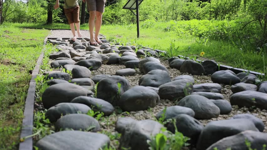 A road made of large boulders, barefoot on the pavement, barefoot trail