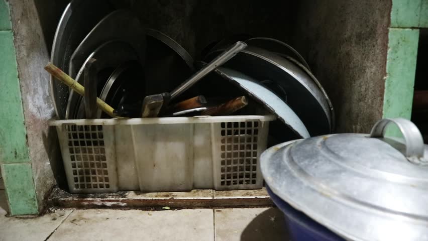 Dirty and messy kitchen with rustic utensils, unhealthy and unhygienic lifestyle