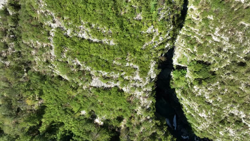 Aerial view at the waterfall in the distance.