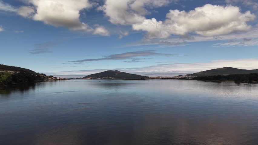 Rio miño river emptying into the atlantic ocean, forming an estuary separating spain and portugal