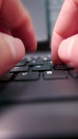 POV (zooming out): hands typing on a computer keyboard on the table. A laptop keyboard. A wireless keyboard. A dusty keyboard. A dirty computer. Writing, close-up. A writer.