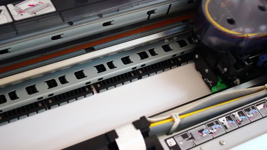Wide format digital printer, plotter in Action. Printing test chart with color