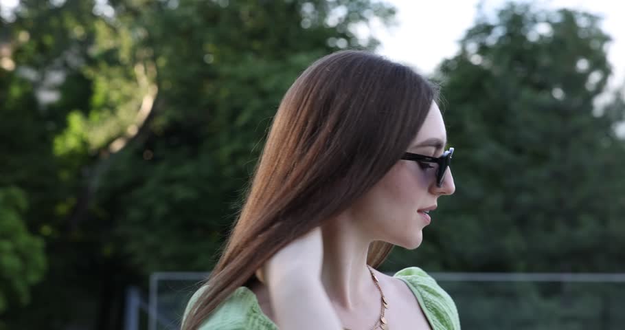 Beautiful young woman in stylish sunglasses outdoors