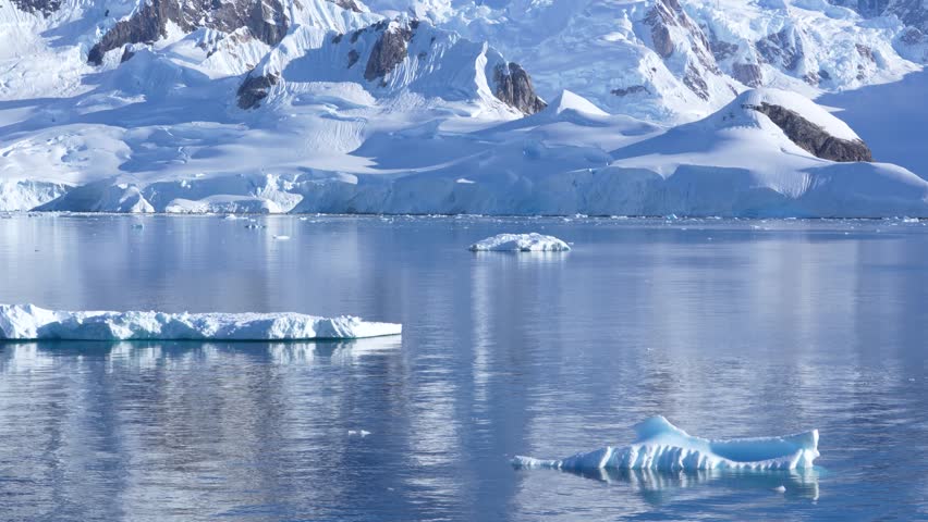 Antarctica Iceberg Close Up Stunning Clarity Sailing in Wilhelmina Bay. Snow Covered Mountain, Glaciers, Mirror Like Southern Ocean Waters Epic