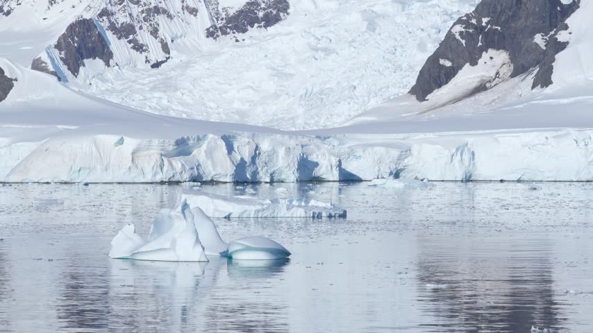 Antarctica Iceberg Close Up Stunning Clarity Sailing in Wilhelmina Bay. Snow Covered Mountain, Glaciers, Mirror Like Southern Ocean Waters Epic White