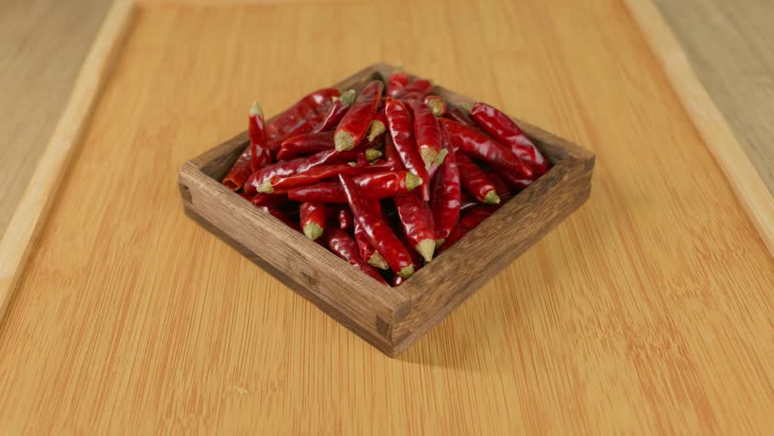 A pile of dried red chili peppers. Popular seasoning used for making tasty homemade meals.