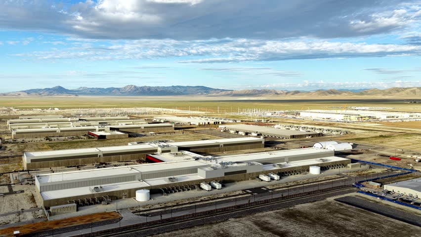 Aerial view of the expansive Meta Data Center complex surrounded by desert landscape and distant mountains in Eagle Mountain, Utah, United States.
