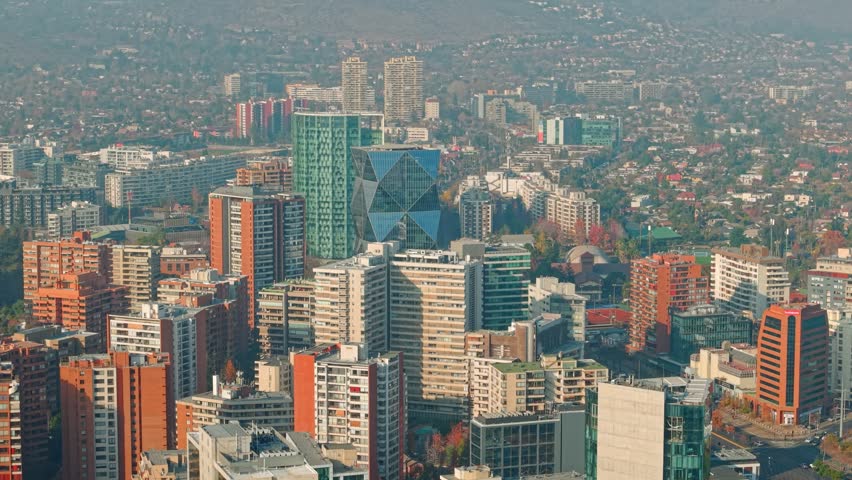Aerial view establishing a mix of architectural styles among the residential and office buildings in Santiago, Chile, in the Las Condes neighborhood