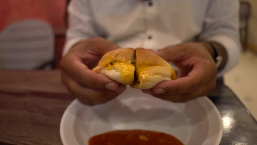 Cheesy Stuffed Bread Roll Pulled Apart by Hands – Melted Cheese Food Close Up