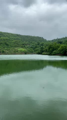 Scenic view of a peaceful mountain lake surrounded by beautiful peaks