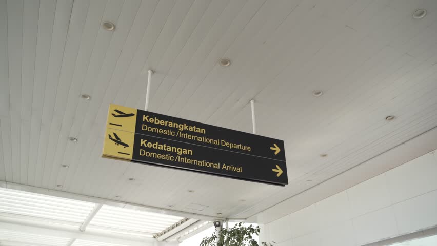 an arrival and departure sign on the airport
