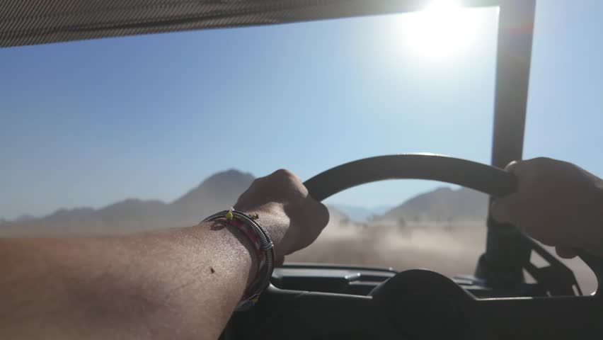 Adventure safari while driving a car in the charming and dusty desert near Sharm El Sheikh, South Sinai, Egypt