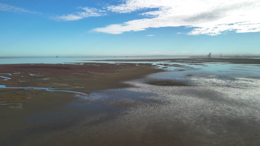Expansive aerial shot over Walvis Bay lagoon and tidal salt marshes, Namibia