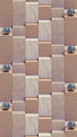 Iron spheres roll down the wooden steps