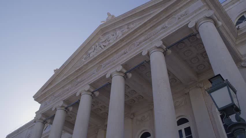 Low Angle View of Rossio Railway Station Facade in Lisbon Portugal During Summer Golden Hour Shot with Cinema Camera