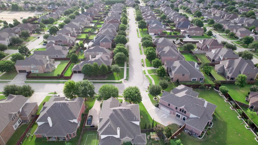 Aerial video of a neighborhood in Frisco Texas, flying over Holly Tree Ln.