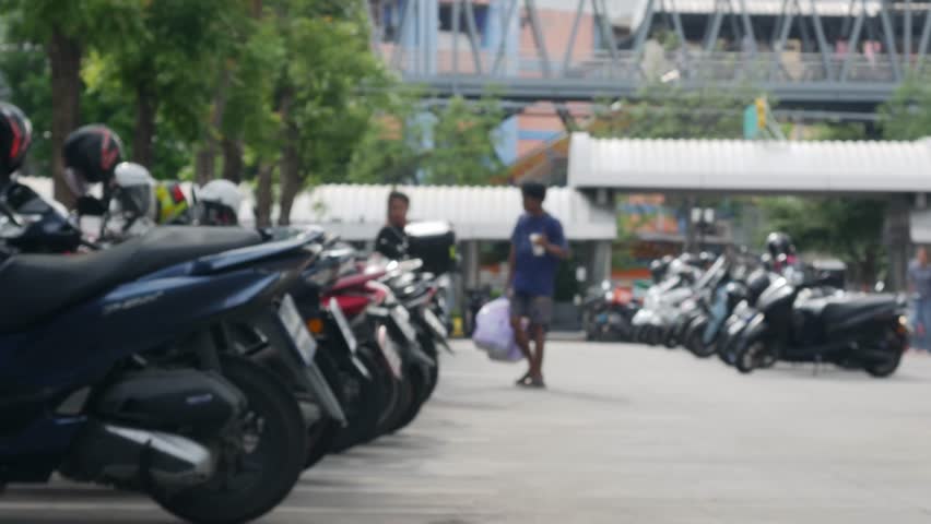 Blurred Defocused Crowded Motorcycle Parking Lot with Trees Outside Urban Shopping Area Street Lifestyle