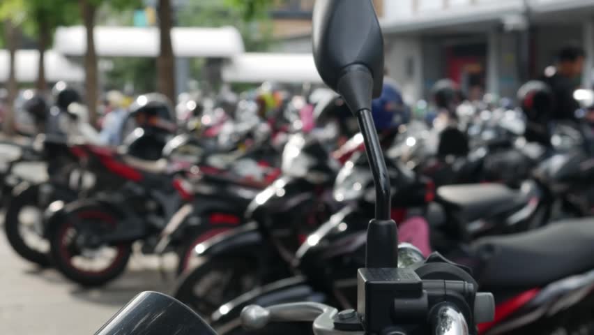 Blurred Defocused Crowded Motorcycle Parking Lot with Trees Outside Urban Shopping Area Street Lifestyle