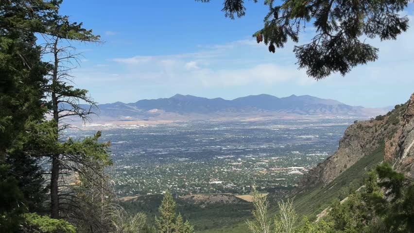 Wasatch Front mountain view, looking across the Salt Lake Valley toward the Wasatch Range. The Salt Lake metro area is visible.