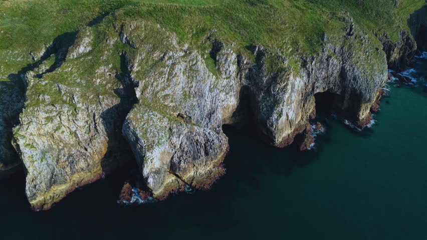 Aerial view from a drone of the coastal landscape and sea cliffs in Prellezo, in the municipality of Val de San Vicente. Cantabrian Sea. Cantabria. Spain. Europe