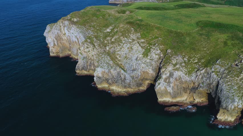 Aerial view from a drone of the coastal landscape and sea cliffs in Prellezo, in the municipality of Val de San Vicente. Cantabrian Sea. Cantabria. Spain. Europe