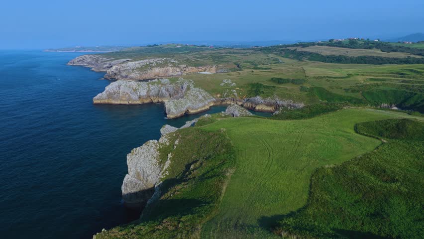 Aerial view from a drone of the coastal landscape and sea cliffs in Prellezo, in the municipality of Val de San Vicente. Cantabrian Sea. Cantabria. Spain. Europe