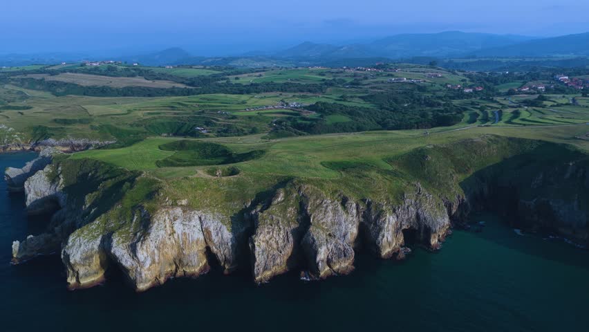 Aerial view from a drone of the coastal landscape and sea cliffs in Prellezo, in the municipality of Val de San Vicente. Cantabrian Sea. Cantabria. Spain. Europe