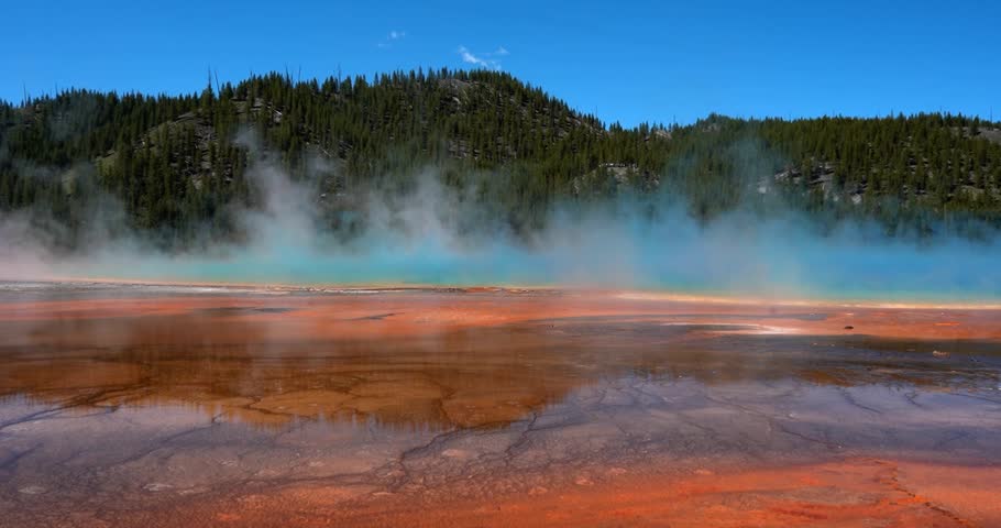 Grand Prismatic Spring, Yellowstone, steaming under daylight, wide shot
